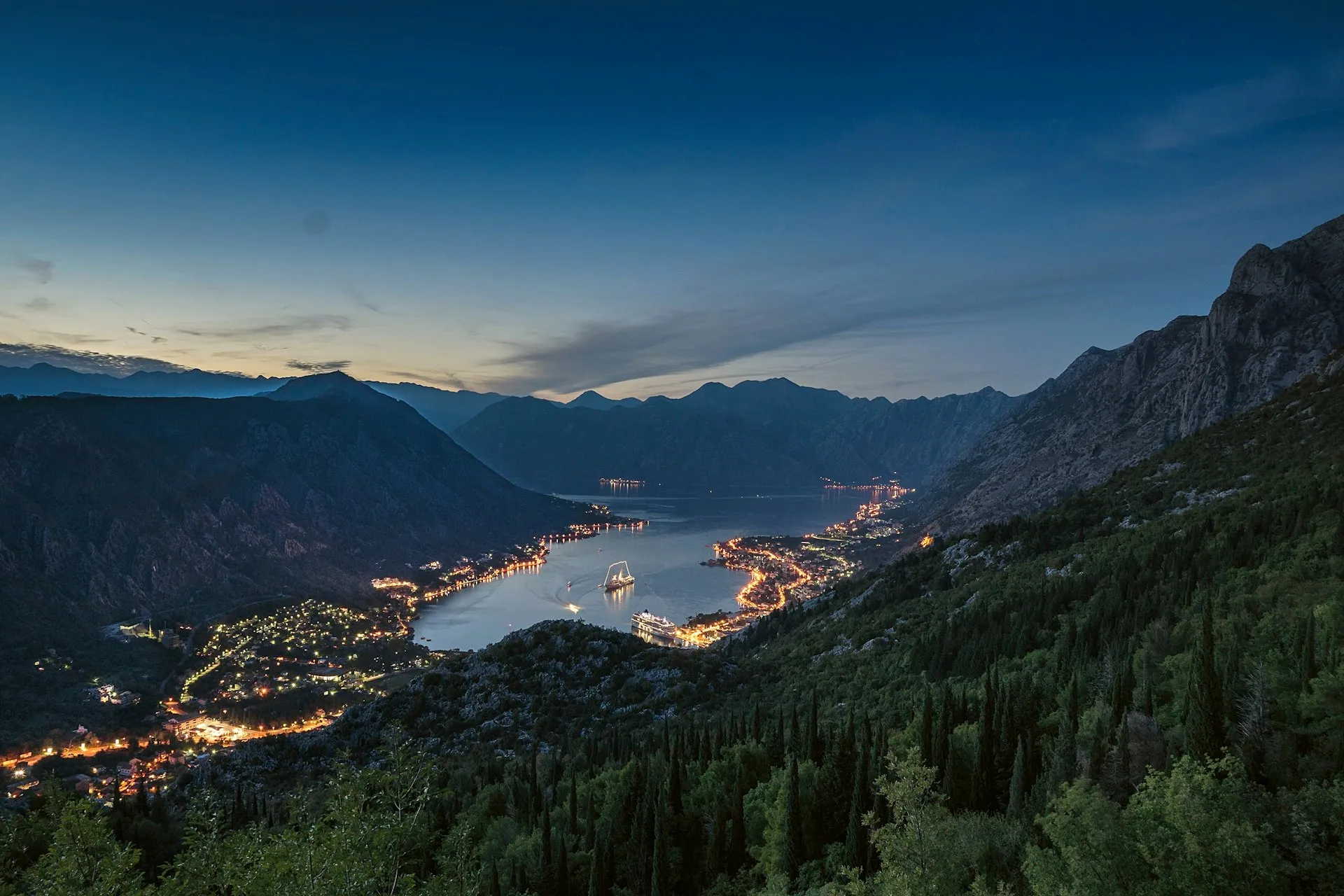 Mountains rising from the calm water of the Bay of Kotor