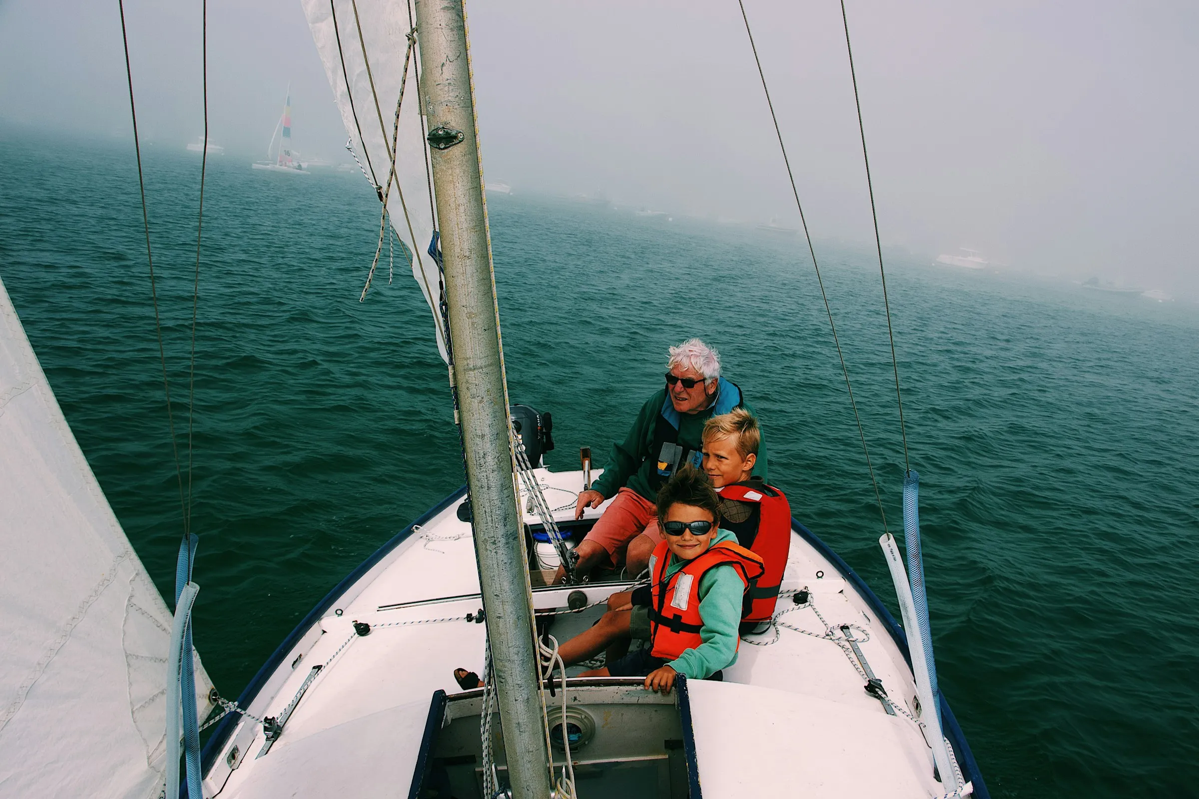 Family sailing together on the open water